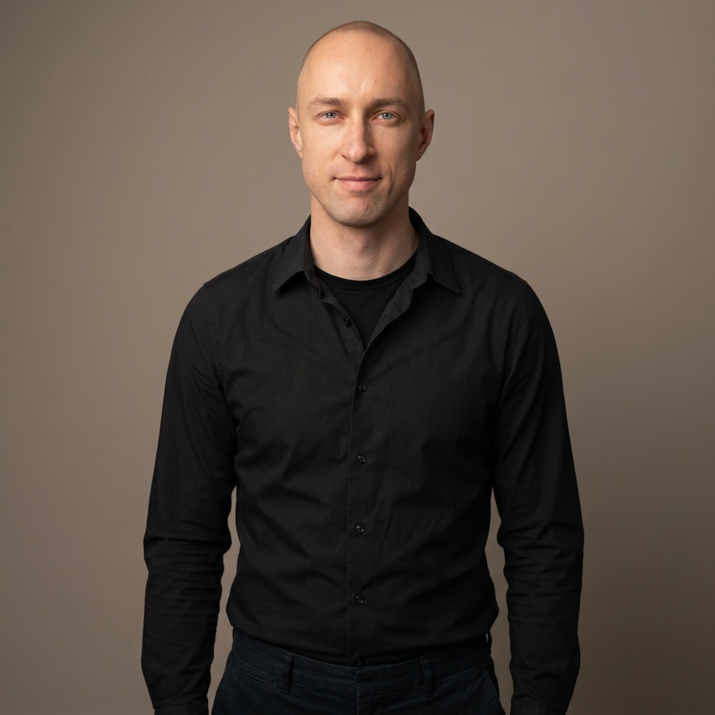 Warm Grey Studio Sweep · Black Button-Up with Dark Trousers headshot example